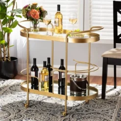 Kamal Glam Brushed Metal And Mirrored Glass 2 Tier Mobile Wine Bar Cart Gold - Baxton Studio -Baxton Studio GUEST 034e04a5 db63 474b 9d05 6c159816da1c